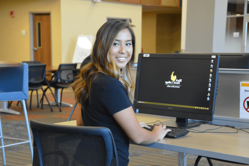 Student in advising center at a Black Hawk College computer